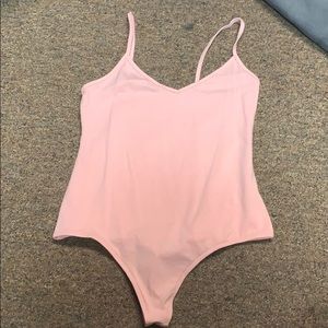 pink body suit